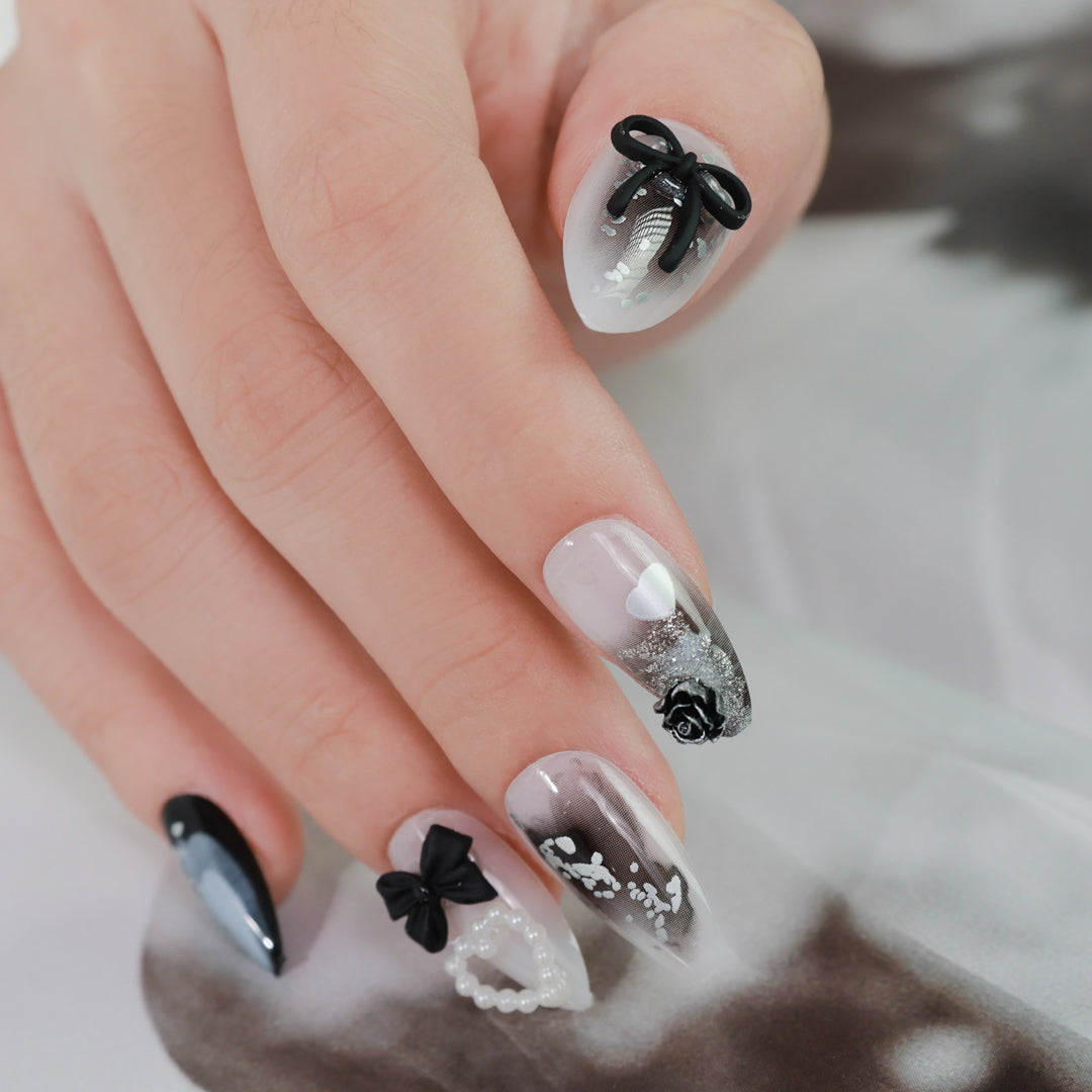 Sleek Black‑White Almond Nail Shape